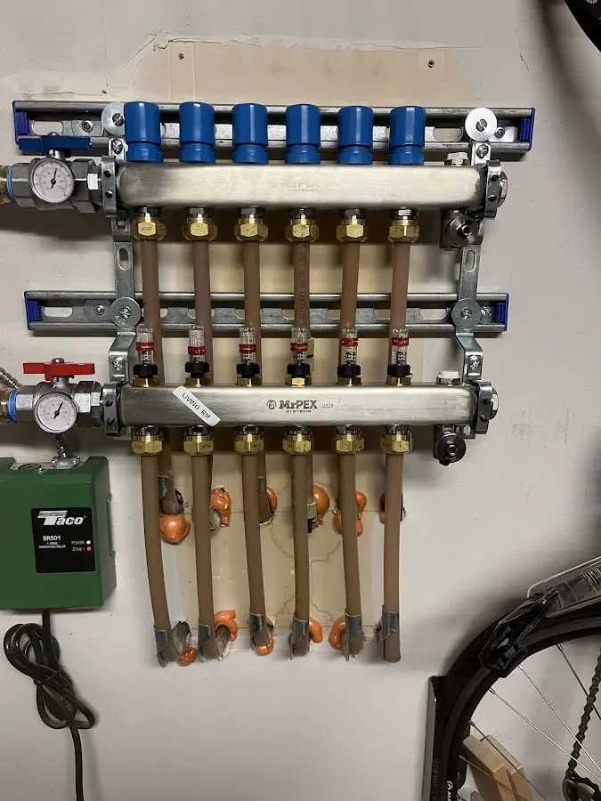 Plumber performing Leak Detection at a residential property in Saranac Lake